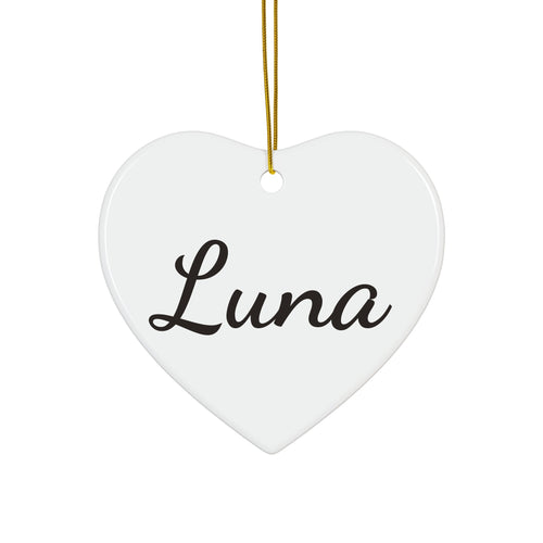 Personalized ceramic Christmas ornament in a heart shape with the name Luna
